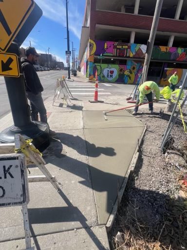 WaldronKC's tweet photo. Our ⁦@KansasCity⁩ Public Works crews and contractors out hustling to improve the pedestrian paths on Berkley Parkway and in River Market in preparation for next Saturday’s first ⁦⁦@thekccurrent⁩ CPKC stadium game. #TealRising https://t.co/bKtEC19UNd