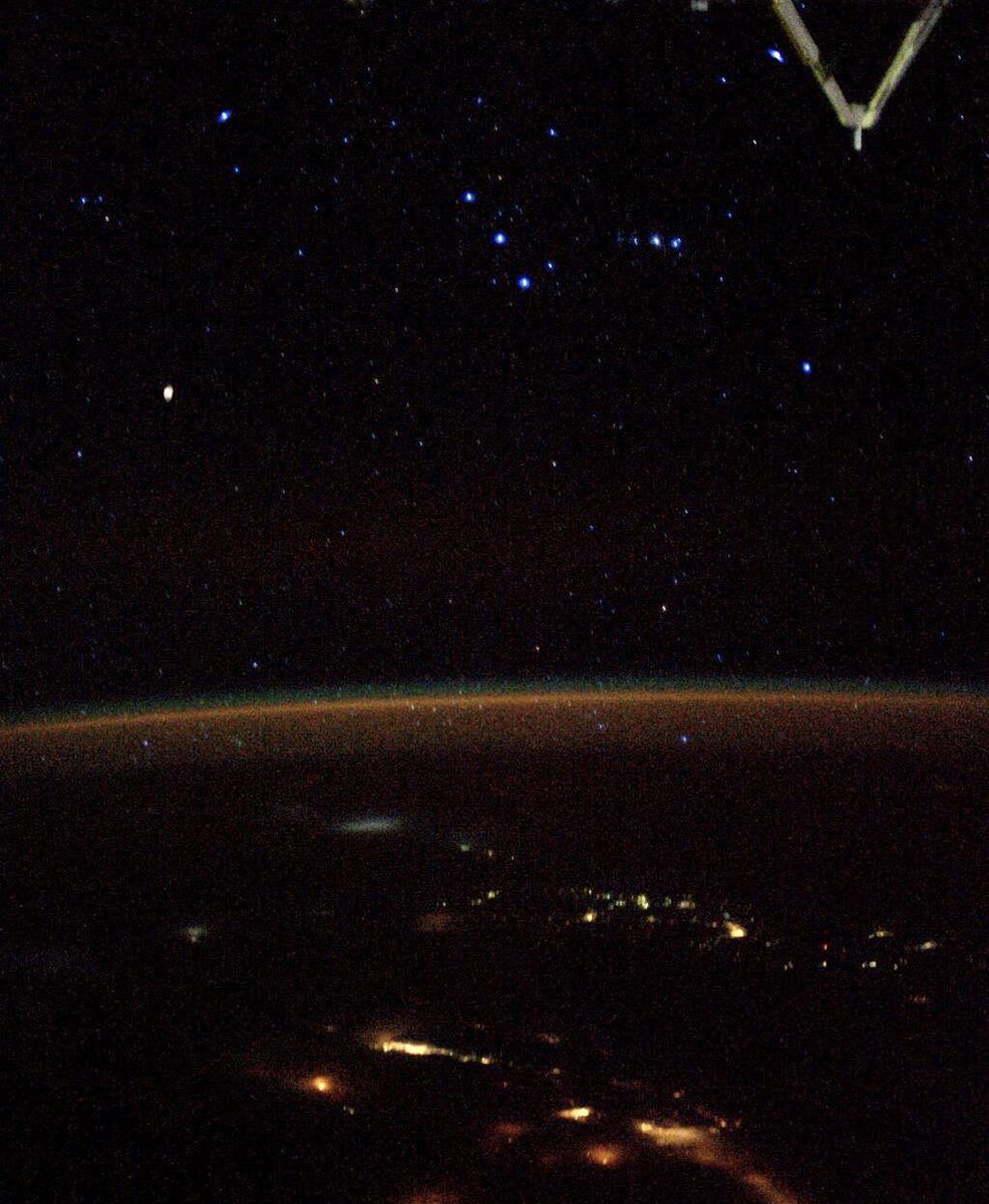 astro_jaz's tweet photo. the constellation orion seen above earth from space 🌌 https://t.co/zbfCkbYmS9