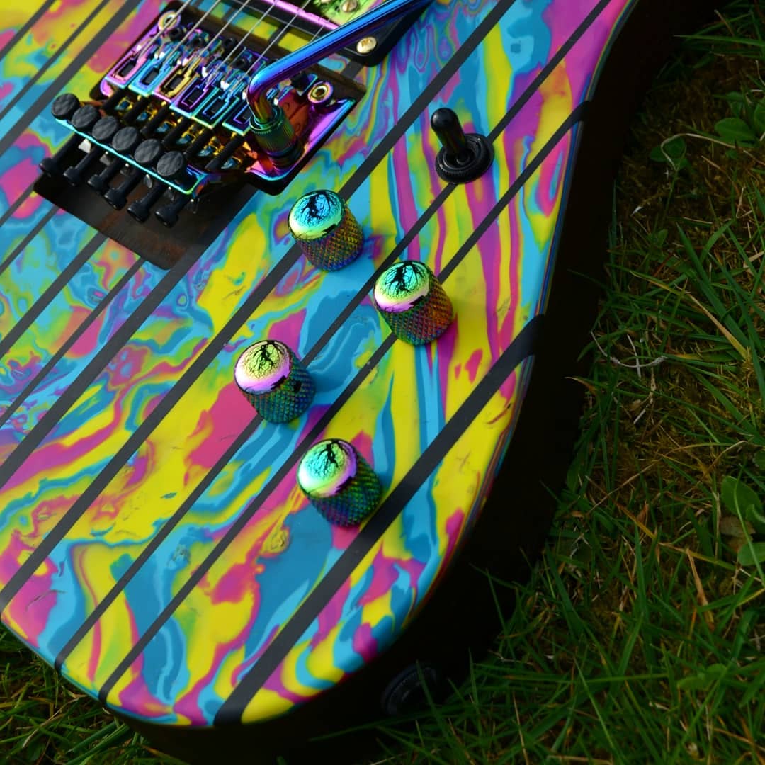 guykeroffi5384's tweet photo. The Bifröst, featuring our signature rainbow chameleon parts, is a visual delight with its dazzling colors and exceptional craftsmanship! 🌈😍

Also, the cyberpunk build he brought to life featuring our headless guitar bridge is seriously impressive and has everyone talking! 🤖✨ https://t.co/31uozXcAMI