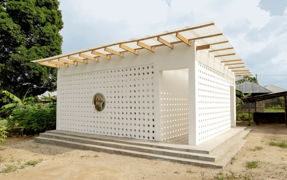 designboom's tweet image. perforated mud brick exterior shields mariam&apos;s #library by parallel studio in #tanzania designboom.com/architecture/p…