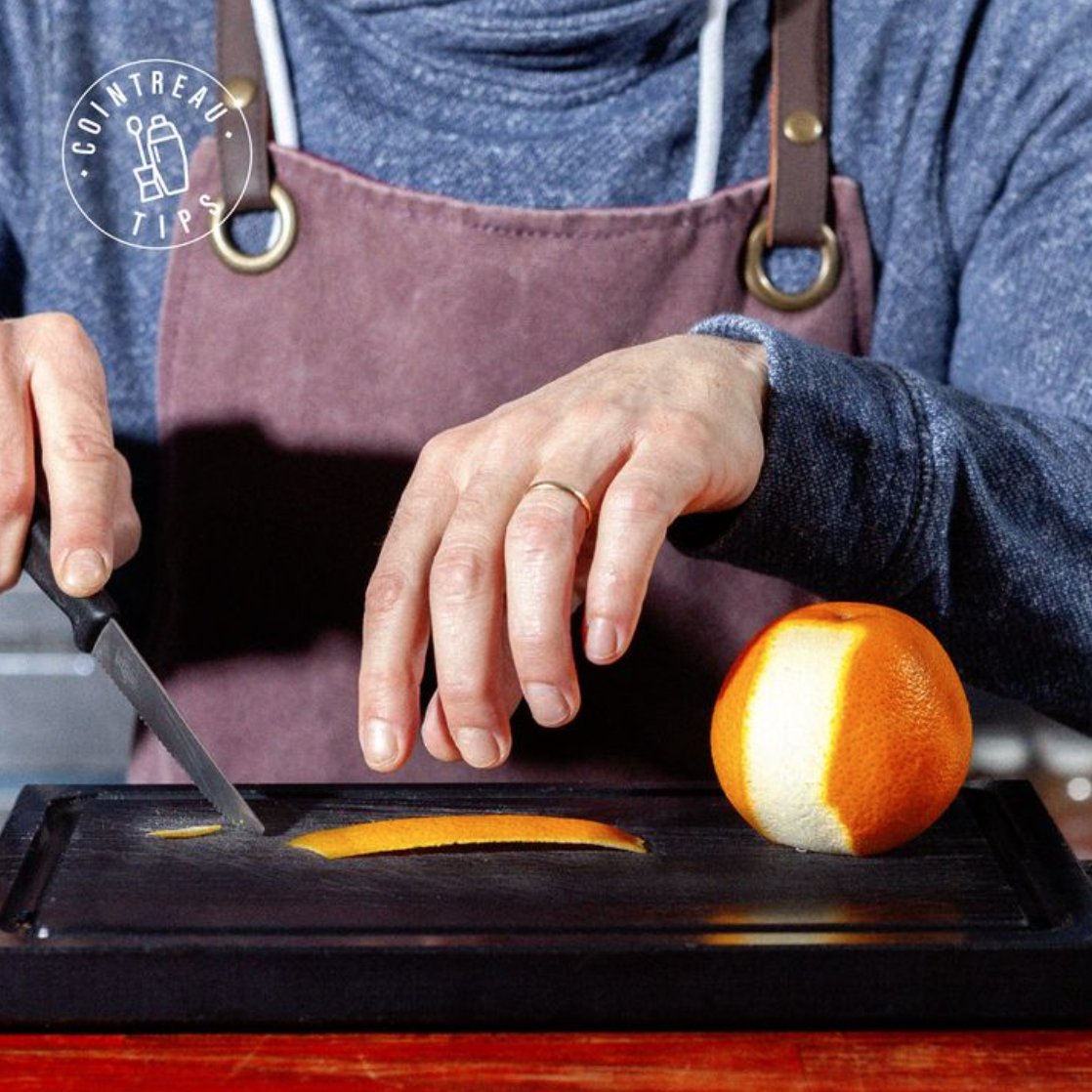 Shake, pour, and garnish! Every cocktail needs a finishing touch, 

Here's how:  Start by making a large zest with a peeler. With a sharp knife, cut one thin strip on each side. Intertwine the strips and tuck underneath. Place on the rim of your glass. Cheers!