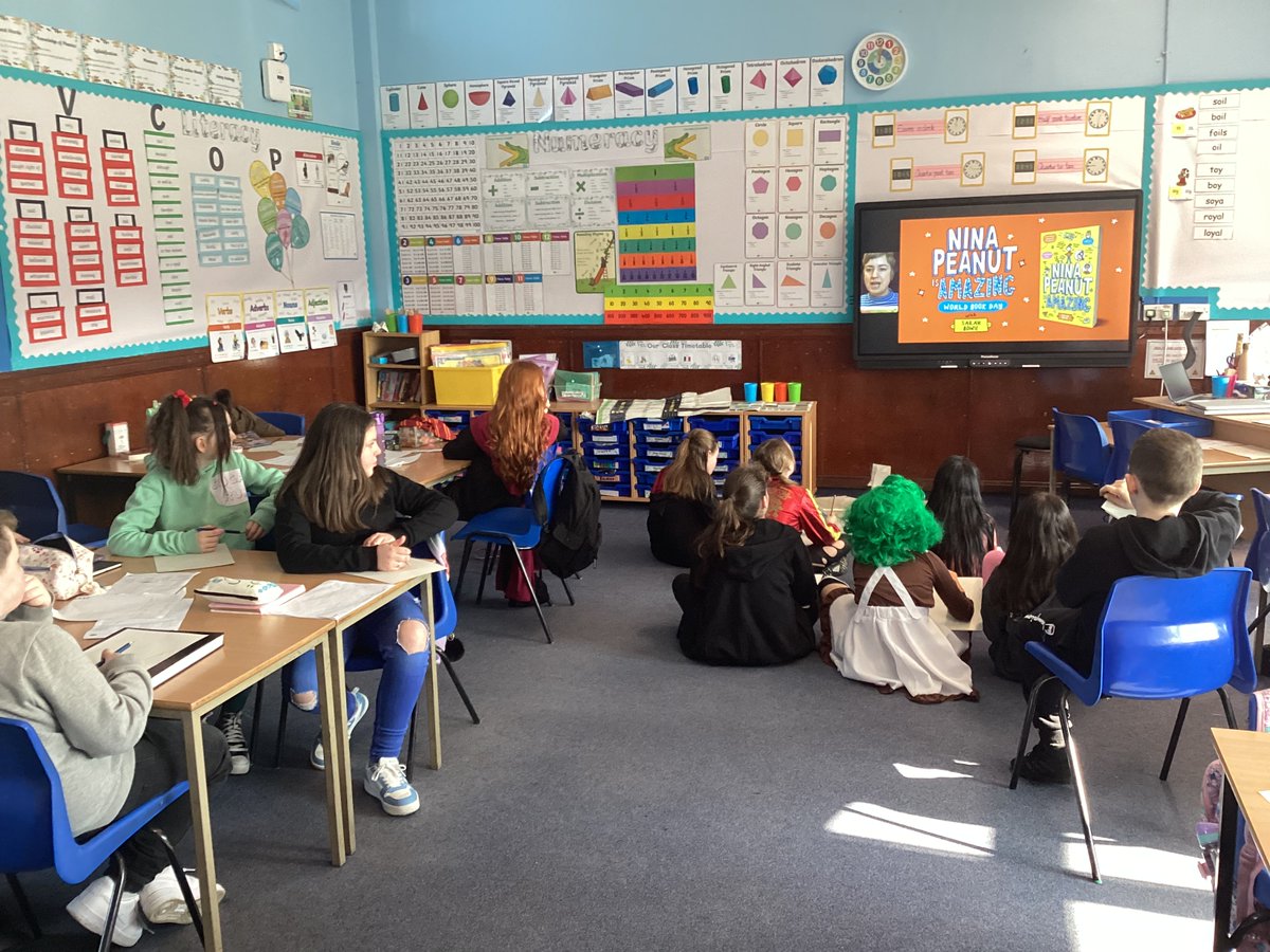 StMonicasNLC's tweet photo. P6/5 enjoying the @Scholastic live session with Sarah Bowie, following along drawing the character #squidge from Nina Peanut is Amazing! #WorldBookDay https://t.co/z1yqivjk90