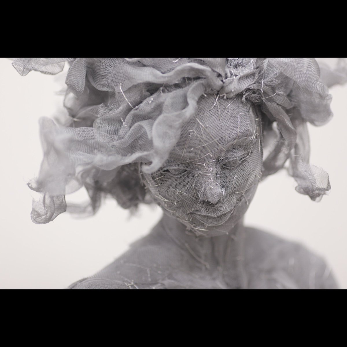 A detail photo of my sculpture GRACE, hand sewn aluminum window screen, steel, wood, paint, 2015, private collection