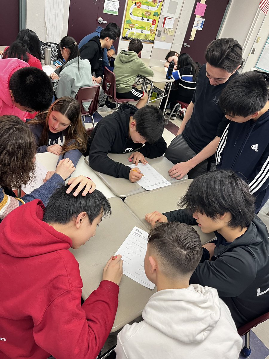 magistrabarbosa's tweet image. Latin II from the high school visits 8th grade Latin for some World Language week fun…Students worked together on a verb activity and Roman numeral math 📚 #worldlanguageweek @WestonWorldLang