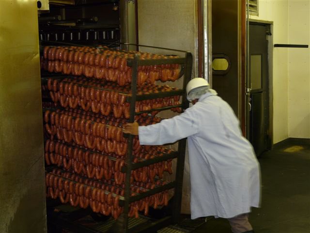 Unloading 4,000 lbs of sausage out of smokehouse