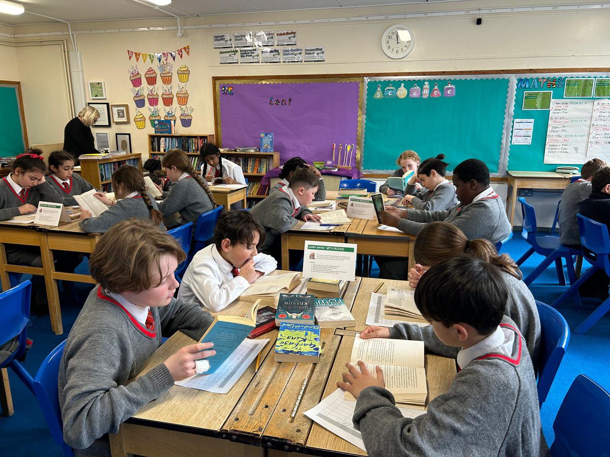 Year 6 speed dating with books for World Book Day. Books are set up at tables around the room ready for children to have a quick visit with the novel!