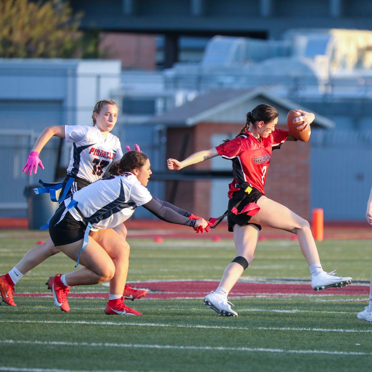 Flag football at Paradise Valley yesterday in a district rivalry game between the Trojans and the Pinnacle Pioneers.