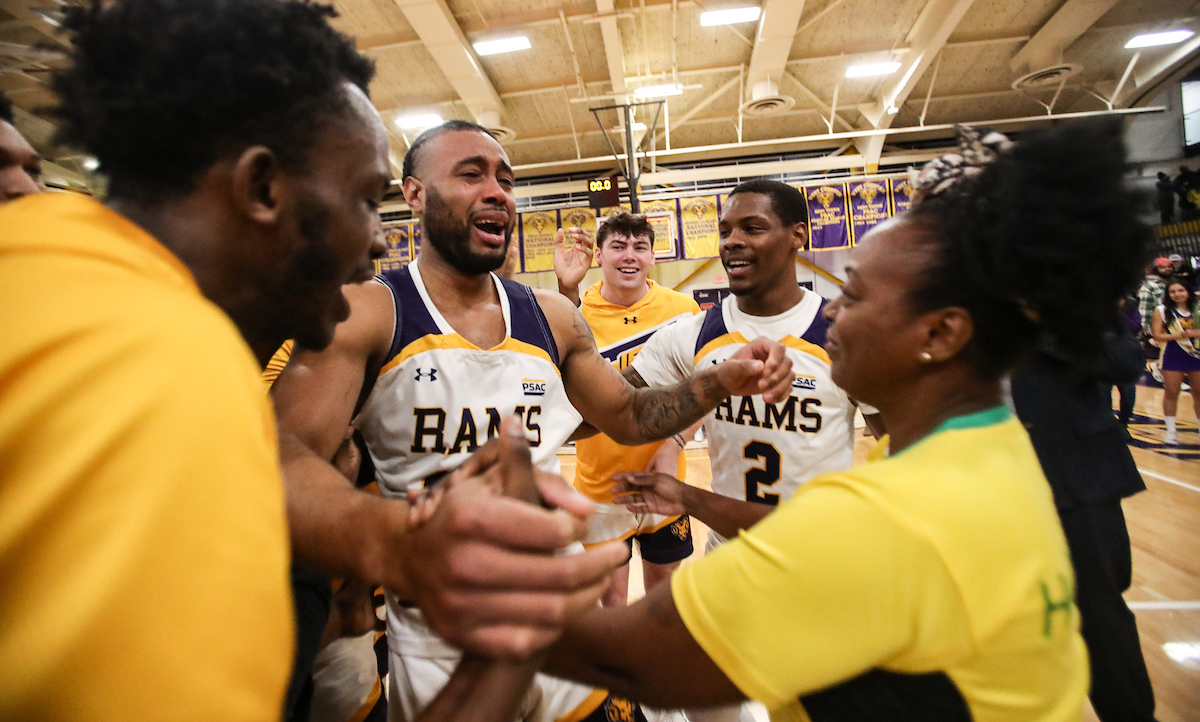 WCUofPA's tweet photo. A photo play-by-play of the unforgettable moment when Jordan Kellier’s parents surprised him from Jamaica and watched him play college basketball for the first time. #WCUAthletics #ChargeON #RamsUP 🏀💜 @WCUAthletics https://t.co/iJzZRZB7u3