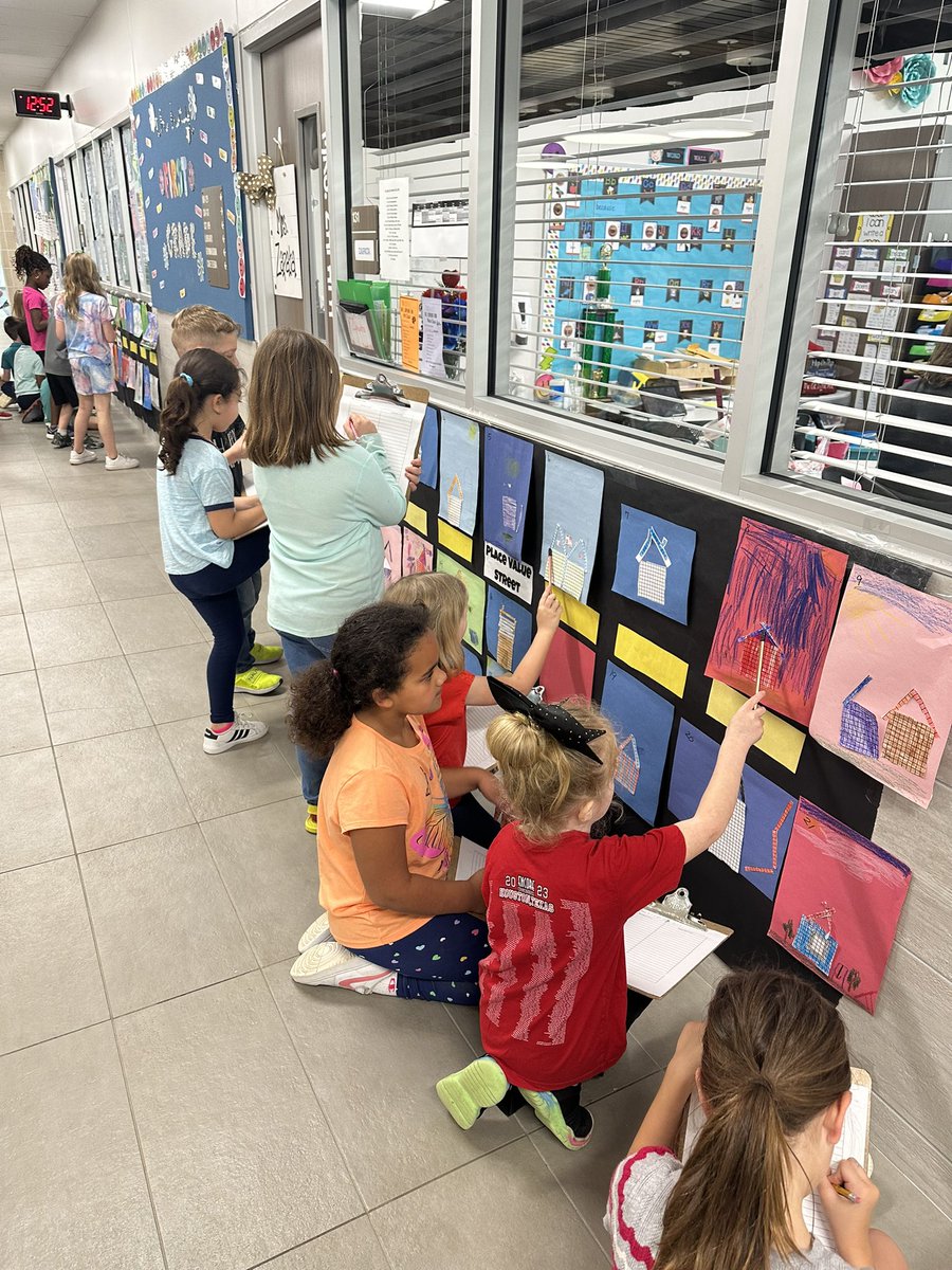 Mcbee1st's tweet photo. Place Value Street in the first grade hallway! Fun &amp; engaging way to get students building numbers &amp; showing the numbers in different ways (expanded form, standard form, etc.).
@WISDLagway https://t.co/IzbmyacPtT