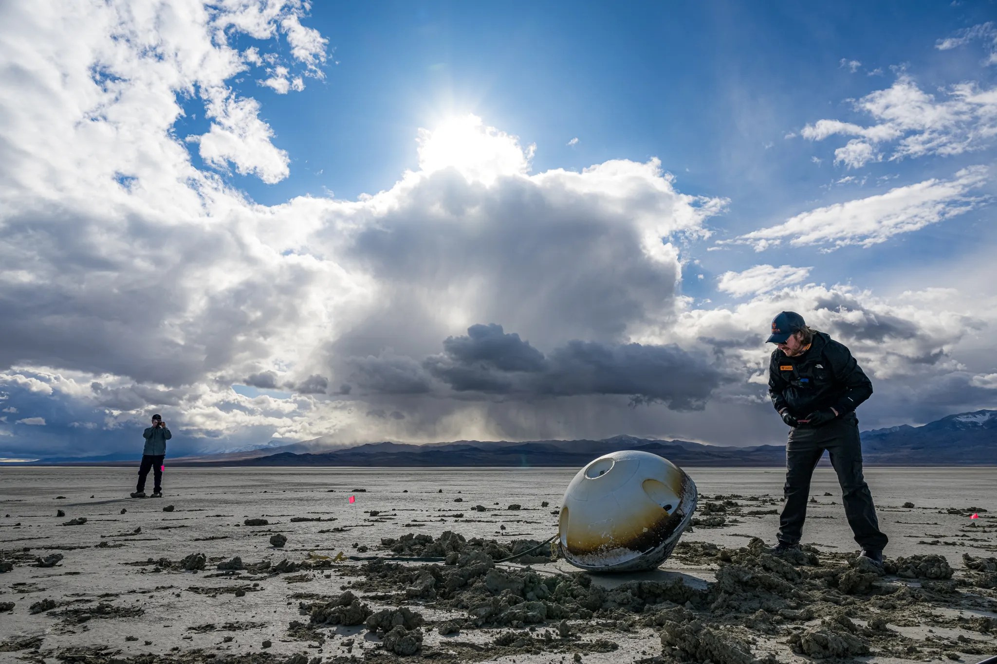 A heat shield made by NASA is visible on the blunt, upward-facing side of a space capsule after its landing in the Utah desert. Varda Space Industries returned to Earth the first product processed on its in-space manufacturing platform on Feb. 21, 2024.
Varda Space Industries/John Kraus