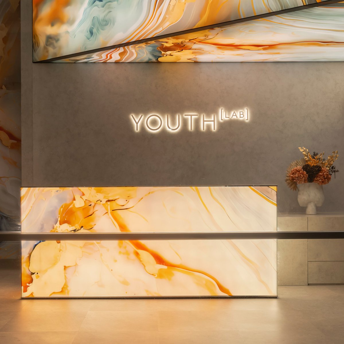 Utilising artificial intelligence we created an augmented marble-esque fictional surface was created.  This surface was then applied to illuminated and non illuminated elements within the interior representing the transformation of skin provided by @youthlabaus