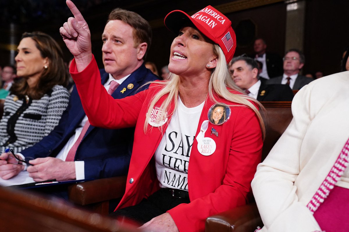 CBSNews's tweet photo. Some Republicans attending President Biden's State of the Union address, including Rep. Marjorie Taylor Greene (R-GA) and Rep. Troy Nehls (R-TX), donned MAGA-tagged clothing and accessories in support of former President Donald Trump. Many also wore pins honoring Laken Riley, a Georgia nursing student killed allegedly by an undocumented immigrant.

📸: Shawn Thew/Pool/AFP via Getty Images, Julia Nikhinson/Bloomberg via Getty Images