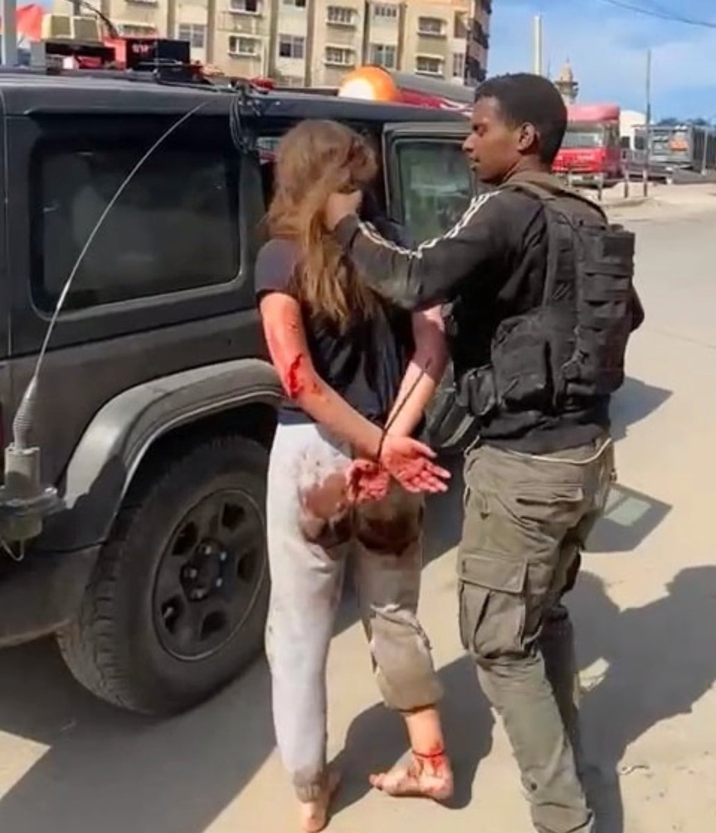 michaeldickson's tweet photo. On this #InternationalWomansDay, here’s a beaten and raped woman, her hands tied and her crotch bloodied, dragged barefoot held her hair by a Palestinian Hamas terrorist AND STILL HELD CAPTIVE IN GAZA FOR 5 MONTHS. https://t.co/DOlyK7S38Q