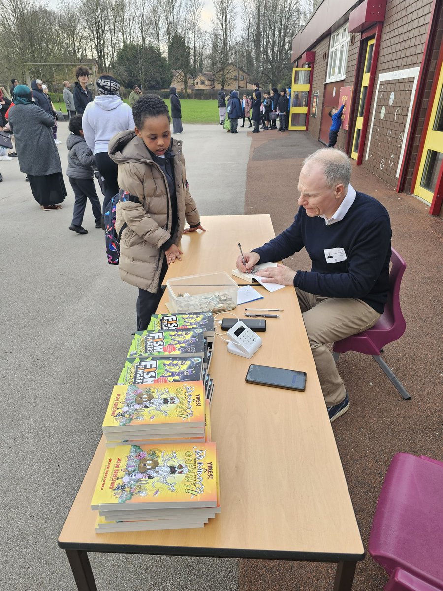 <a href="/jason_beresford/">Jason Beresford</a> selling and signing books after school.