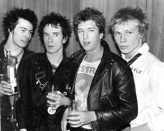 On this day in 1977, Sex Pistols staged a signing ceremony for A&M Records outside Buckingham Palace under the noses of the police and establishment. They also announced 'God Save The Queen' as the first single, however, the band were sacked from the label after only one week.