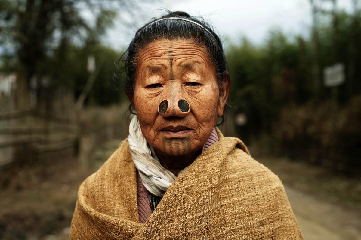 🛖 Apatani Tribe, Arunachal Pradesh, India 🇮🇳

The women of Apatani tribe wear large nose plugs and face tattoos. But contrary to popular assumptions of face piercing and tattoos, the Apatani women do not use them for reasons of beauty.