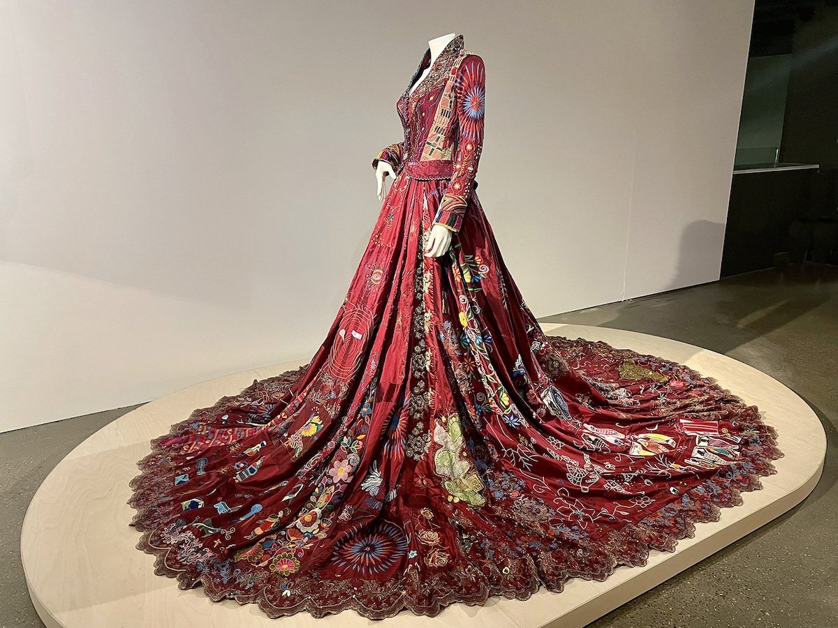 vickyhaddock's tweet photo. On #InternationalWomensDay let us celebrate The Red Dress Project conceived by artist Kirstie Macleod. Between 2009 and 2023, 380 embroiderers from 51 countries, many of whom were vulnerable, told their personal stories through embroidery on burgundy silk dupion #WomensArt #dress https://t.co/yyBrircihi