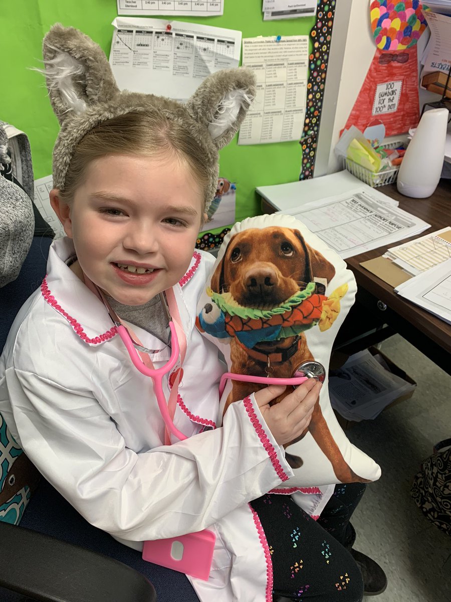 My little veterinarian is giving Odie a check-up for dress for your future career day