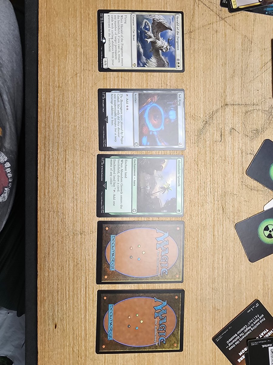 Paydronian's tweet photo. @Wizards $50 for this brand new Fallout deck and most of the cards are shoddily cut. (Far left correct cut for comparison.) I bought all four Fallout decks. I hope the other 3 aren't like this. Really disappointing. https://t.co/RBmipq8ujl