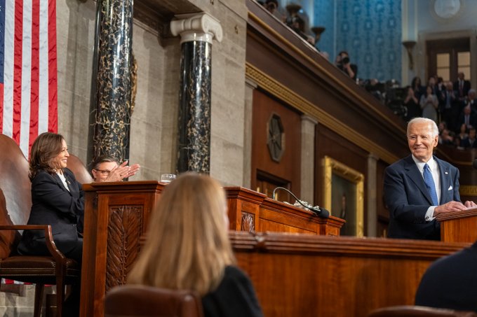 President Biden looks back at the Vice President while delivering his State of the Union.