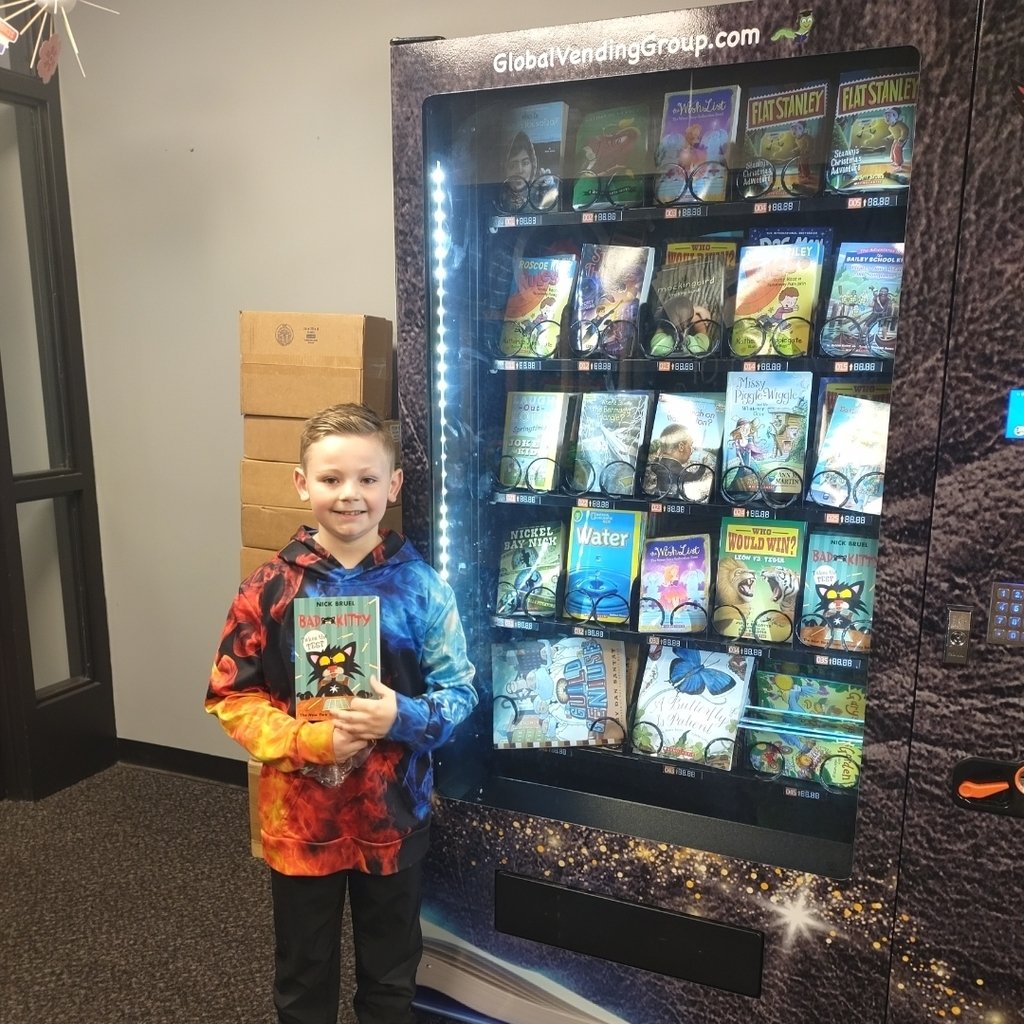 JJ was excited to get a book from the gold coin he earned! #WeAreMCUSD