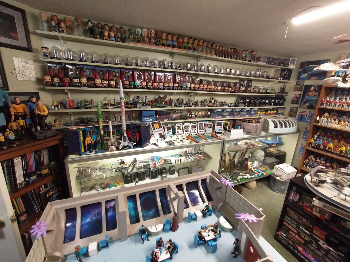 I had an uncle who passed recently, and he owned one of the largest Star Trek collections in the country (USA). This is 4 of over 90 pictures required to document 3+ entire rooms stacked with nothing but #startrek pls share it around, I want to give it a good home.