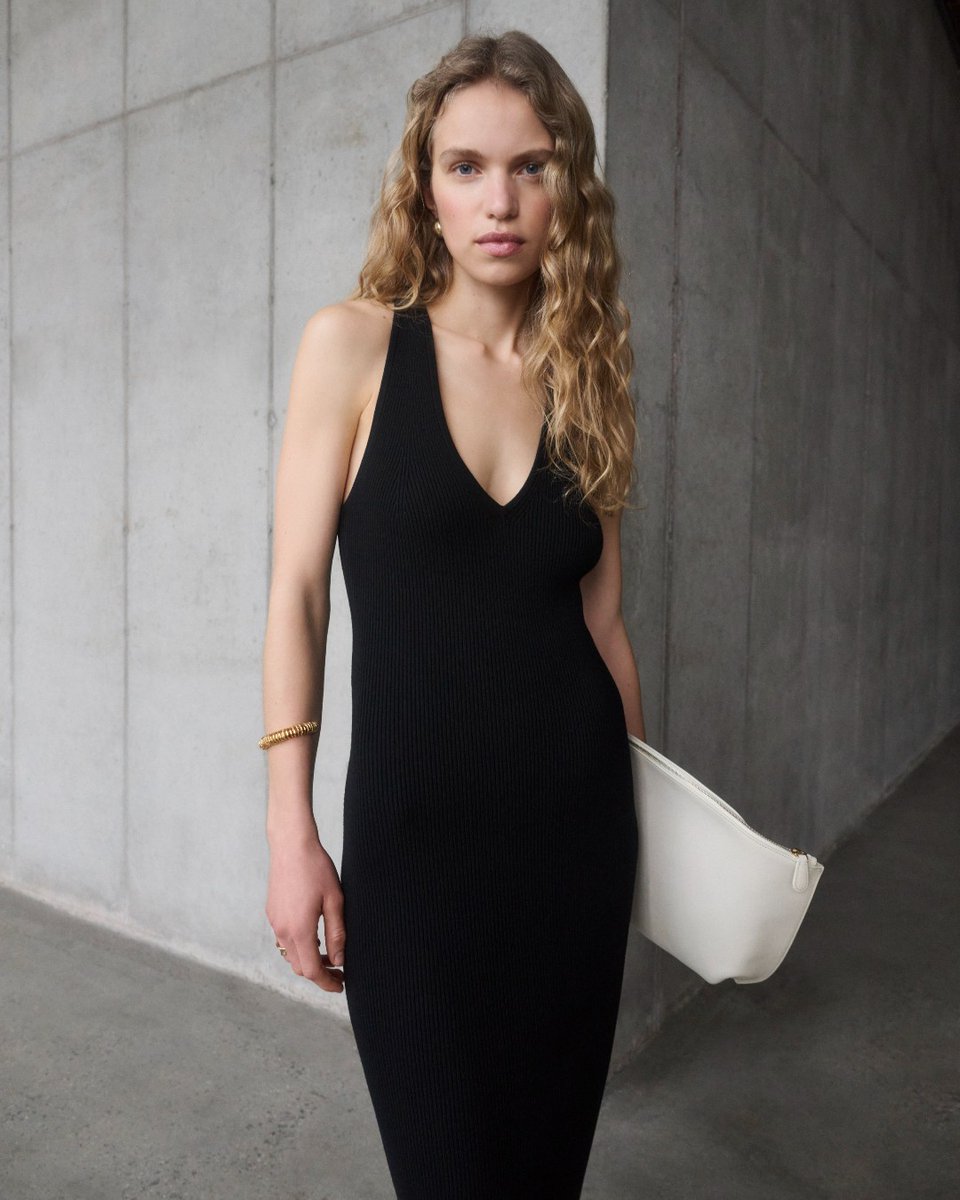 Introducing the modern black dress: a body-skimming rib knit with cross back straps. Day-to-night dressing just got chicer. bit.ly/49WzUpe