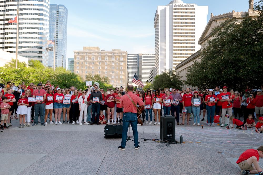 voices4saferTN's tweet photo. Voices for a Safer TN  asks the community to wear red &amp; link arms to honor the memory of the Covenant victims and the hundreds of TN lives lost to preventable firearm tragedies over the last year. Register here: https://t.co/HMk5Qf47Q2 https://t.co/TnHIXarp5I