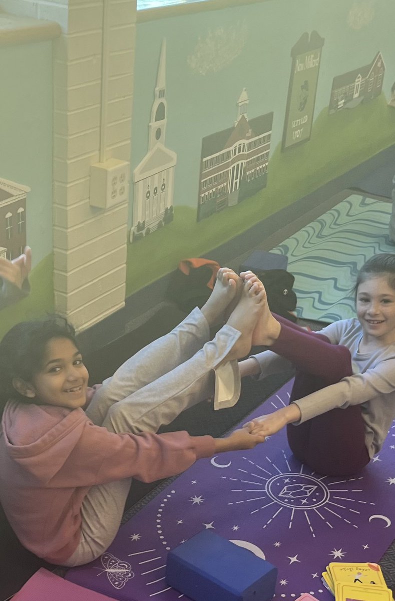 3rd grade Yoga Club breathing, stretching, and partnering up!