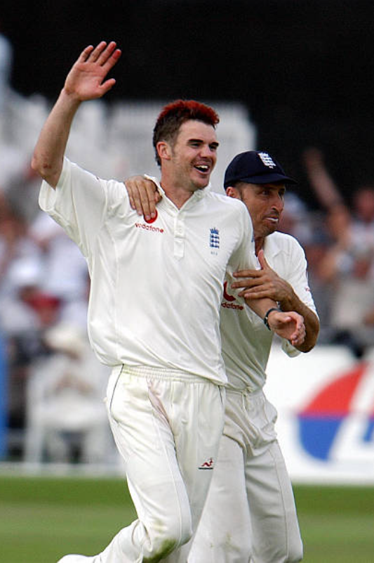 RandomCricketP1's tweet photo. James Anderson has finally conquered Mount 700, becoming the first fast bowler to reach there. He is also a living embodiment of the adage of 'It's not how you start that matters but how you finish.' His beginnings were not so bright. Always.

In fact, his first delivery as a professional according to him was the worst he ever bowled. Playing for Lancashire's 2nd XI against Surrey's 2nd XI, he was so nervous when the ball was thrown at him  that his legs felt like jelly when he ran in to bowl. The result was him falling flat on the pitch and taking out the leg and middle stump with his back leg. As he picked himself up to bowl again, umpire Ian Gould asked him 'What the hell was that, son?'

That fall was still playing on his mind when he was handed the debut against Zimbabwe at Lord's in 2003. If the nervousness wasn't enough, the hair-color had already got him some looks from the purists at Lord's. All of this was reflected in the first over Anderson bowled in Test cricket which began with him running in fast only to bowl a no-ball as his first delivery. By the time the over ended, he had conceded 17 runs to Dion Ebrahim who kept making the most of Anderson's straying down the leg-side. Captain Nasser Hussain, possibly thinking that starting with a fine leg against Zimbabwe could be construed as too defensive, went for an extra-slip instead and left the region vacant for Ebrahim to make the most of. Already nervous and now with the embarrassment of having conceded 17 runs in his first over with that colored mop, Anderson began to worry about his prospects.

At this point, skipper Hussain ran up to the bowler, put an arm around his shoulder and said, ‘Sorry, that was my fault. Start again next over.’ Anderson enjoyed the services of a fine-leg throughout the innings in which he ripped through Zimbabwe's batting lineup with a five wicket haul on debut. He has, of course, added some 600 more to that tally in the subsequent years. Who knows what would have been the case had Hussain stuck to his plans and wasn't humble enough to apologise to the debutant for what was essentially his fault. Also, I wonder how many who watched Anderson bowl that first over on that morning thought he would become the most capped English cricketer 18 years down the line.

Ps - Hussain wasn't so kind to Anderson on his ODI debut a few months ago where he made the debutant stand right below Bay 13 at the Melbourne Cricket Ground which is infamous for hurling down the choicest of words towards the opposition players, worse if you're an Englishman. Since Anderson's debut wasn't planned, he was wearing an oversized kit with no name and number and that just provided the perfect starting point to the Aussie fans for the insults to be thrown at the youngsters. Considering all the abuse the youngster copped, to return with figures of 1/46 from 6 overs doesn't look that bad.

Photo by Paul Barker