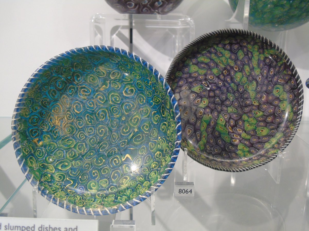 Two #Roman glass dishes, decorated with vivid spiral patterns &amp; stripes around the edges. The colours are so vivid &amp; eye-catching, almost hard to believe that these dishes are 2000-2200 years old! #Archaeology #AncientGlass