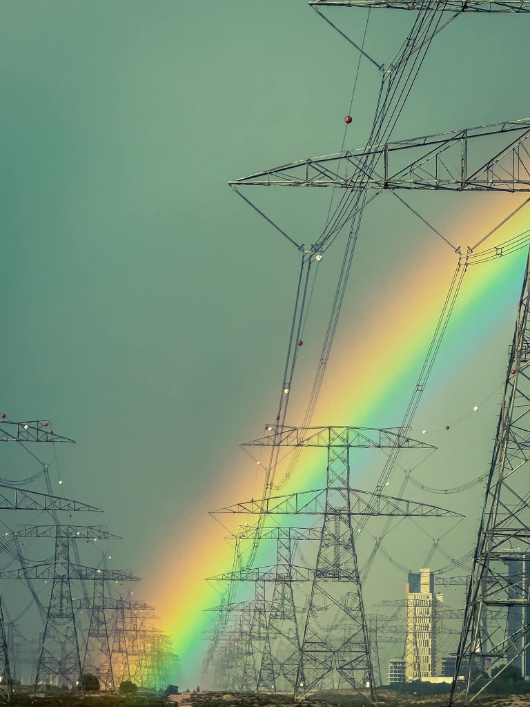 Rainbow’s do happen in Dubai! Unlike in RSA these power lines supply electricity 24/7! #travel #Dubai #UAE 🇦🇪 #rainbow #rain #weather