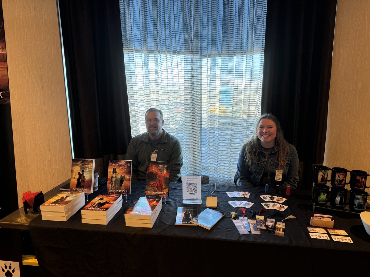 Day two of MarsCon 2024 is about to begin and my helper today is Kiara.  Lexi was here yesterday.  Stop on down and catch me and some of the other authors and vendors.

#marscon2024 #sciencefiction #fantasy #MN