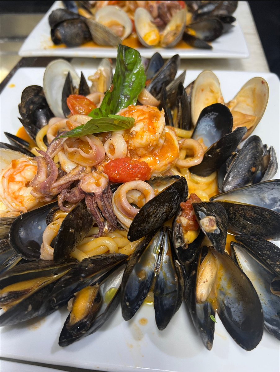 Love seafood? Try our Frutti di Mare dish at Rocco's Cucina & Bar! Shrimp, calamari, mussels & clams in a flavorful marinara sauce over bucatini pasta 🍝 Trust us, it's a customer favorite! 😍 #fruttidimare #seafoodlover #roccoscucinaandbar #deliciousdinner