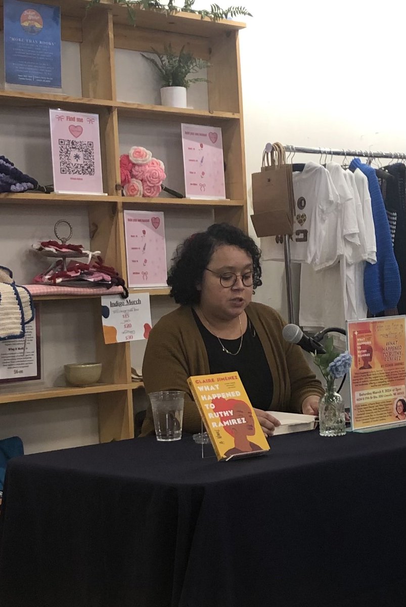 Dr. Claire Jiménez, ⁦@penfaulkner⁩ finalist, reading from ‘What Happened to Ruthy Ramirez’ at ⁦<a href="/BridgeIndigo/">Indigo Bridge</a>⁩ in #LNK.