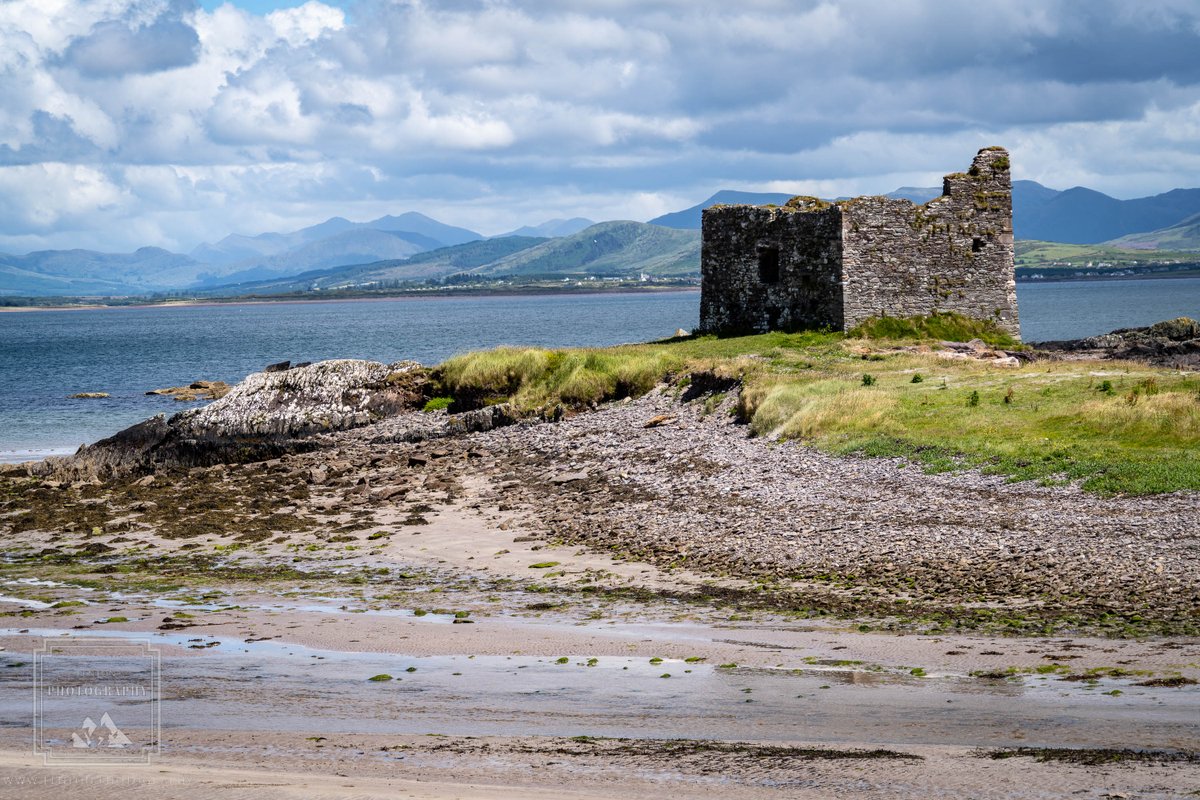 Sea level view on the Ring of Kerry. #clouds #graysky #ruins #RingOfKerry #shoreline #beach #castle #grass #water #travel #photography #ireland #landscape @NiksImages @TravelnChill @travelireland @Traveliremag