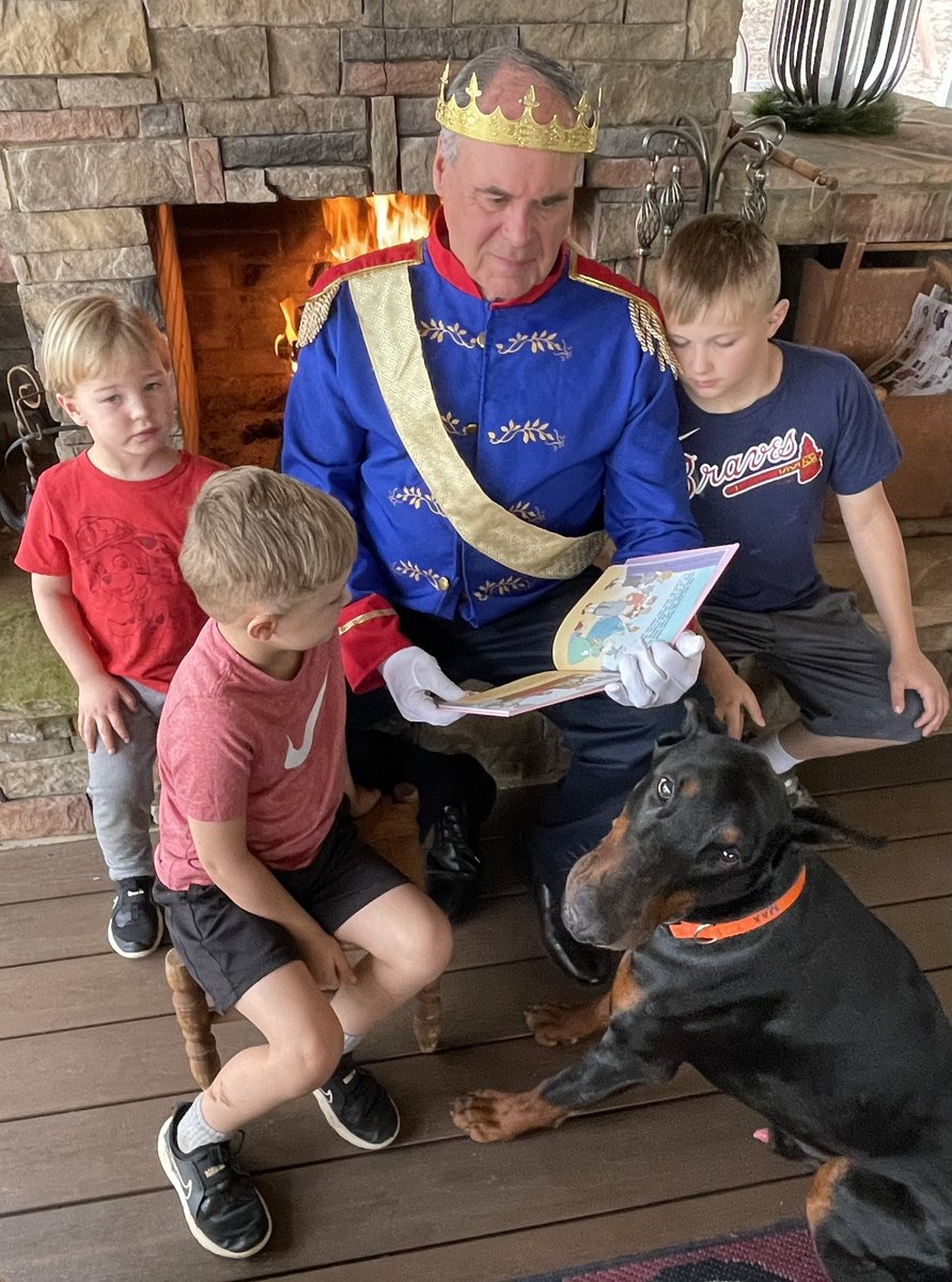 One of my favorite things to do! Enjoying a Saturday afternoon on the porch while reading to my grandkids and Max! Please visit carrollferst.my.canva.site to cast a vote for me while supporting the FERST Foundation of Carroll County!