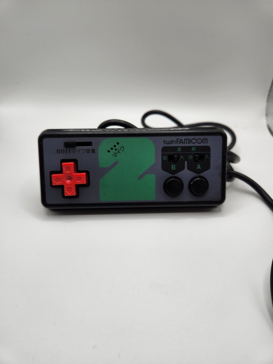 Posting one controller from my collection everyday until I run out, posted in no particular order.  Here we have controller #12, the second controller of a Sharp TwinFamicom.  It lacks Select &amp; Start buttons, but has a microphone in it.