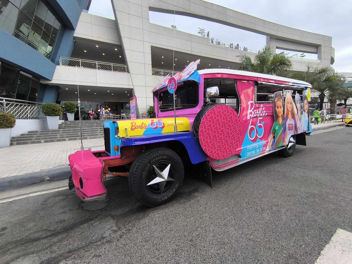 carguideph's tweet photo. In celebration of 65 years of Barbie, catch this special jeepney (and an equally pink convoy) touring around Metro Manila to inspire the kids on the street to shape the future. #Barbie #BarbiePH #Barbie65thAnniversary #CarGuidePH https://t.co/5hyuxrTVuY
