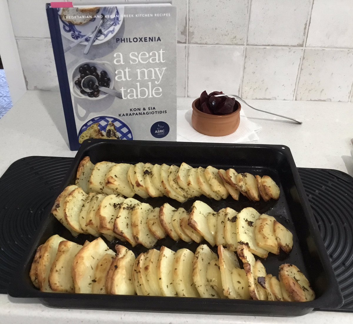 Dropella's tweet photo. I don’t cook at all but gave this a go something easy to start off with Potates lemonates. Bought this recipe book #aseatatmytable @Kon__K. Can’t wait to try some others. https://t.co/8yPGqg5ItN