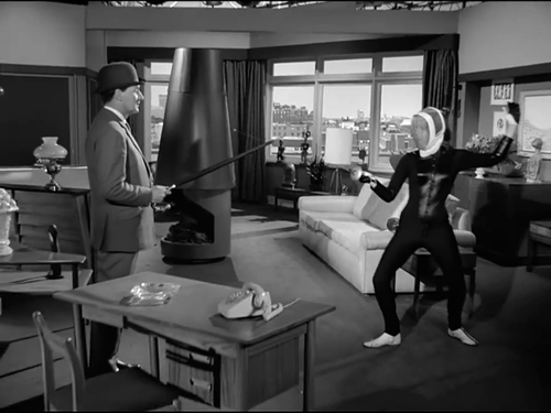 RodneyMarshall1's tweet photo. Literal and verbal fencing as The Town of No Return introduces Emma Peel and Harry Pottle's octagonal penthouse apartment set, with its sliding doors and central hooded stove...as modernist and contemporary as its owner. https://t.co/zenjMOWLKg