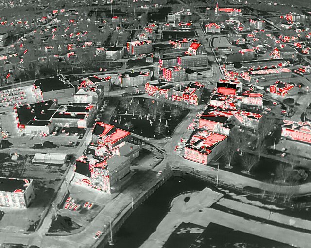 L19guy's tweet photo. A thermal image of downtown Newcastle, Miramichi. The red surfaces are warmer than all of the other above-ground surfaces because they are in direct sunlight - or losing internal heat - and are at a slightly higher temperature. #Miramichi #thermalimage https://t.co/RyATLrKlwc