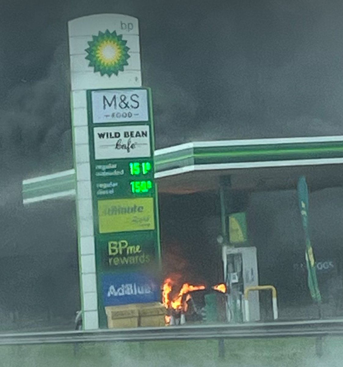 Sareyware's tweet photo. Christ almighty. We’ve just  passed by this at the Rowley Mile BP garage on the a14. Two cars on fire in the forecourt. This is on the Eastbound carriage way. https://t.co/MHroFa83Rx