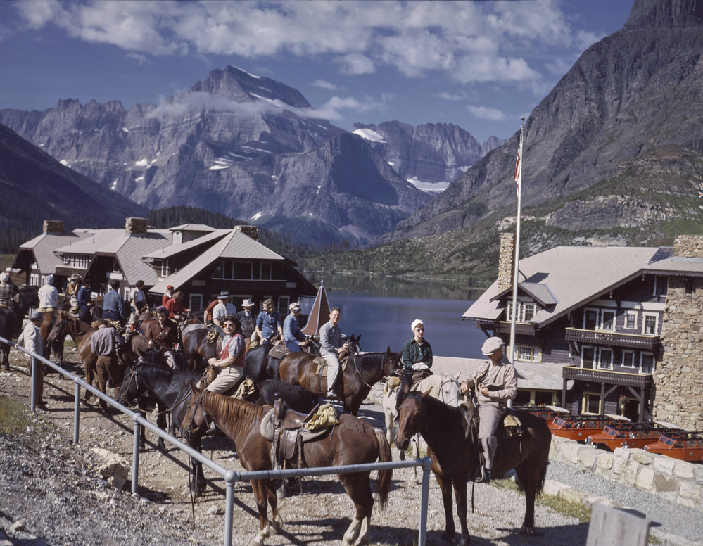 Visitors prepare for a trail ride in Many Glacier. Photo by TJ Hileman This photo is undated, when do you think it's from?