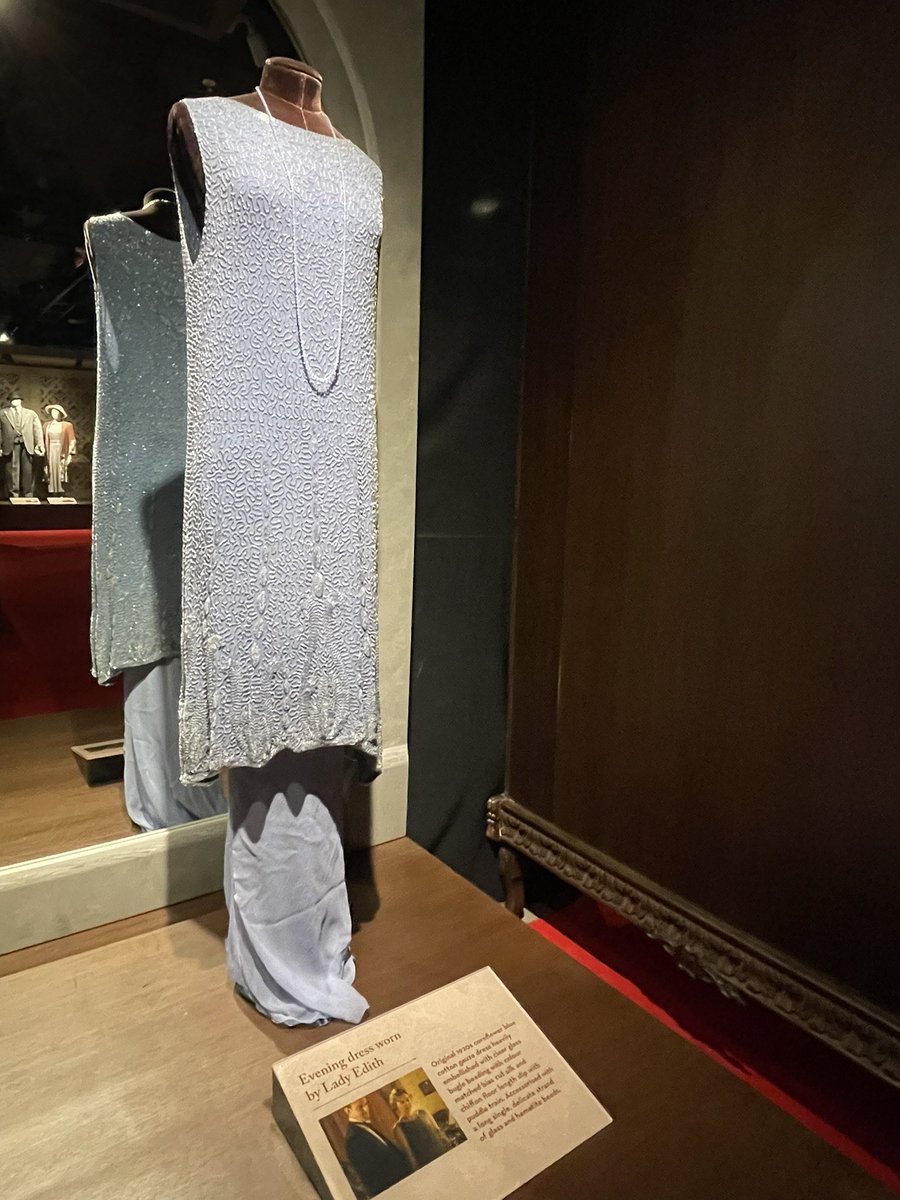 Had an enjoyable couple of hours at the Downton Abbey Exhibition. Here's  the servants hall, the dining room, an evening dress for Lady Edith and her second  wedding dress.