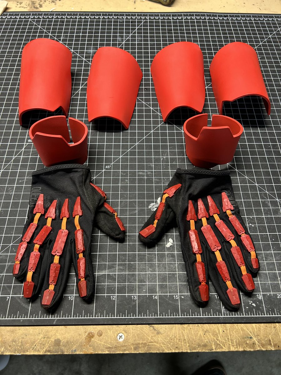 TheRealEvanCray's tweet photo. Some more updates! Cybernetic forearms are painted with their base red. The gloves are repainted to be red. And I think the jacket is done…for now. BUT! It runs under its own power now with a small power bank that I keep on the strap on the jacket. #cyberpunk https://t.co/HETFvNUsIF