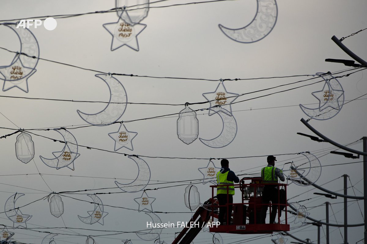 Iraqi workers install street decorations in the southern city of Basra ahead of the Muslim holy fasting month of Ramadan, on March 10, 2024. Hussein Faleh / @AFPphoto - @AFP