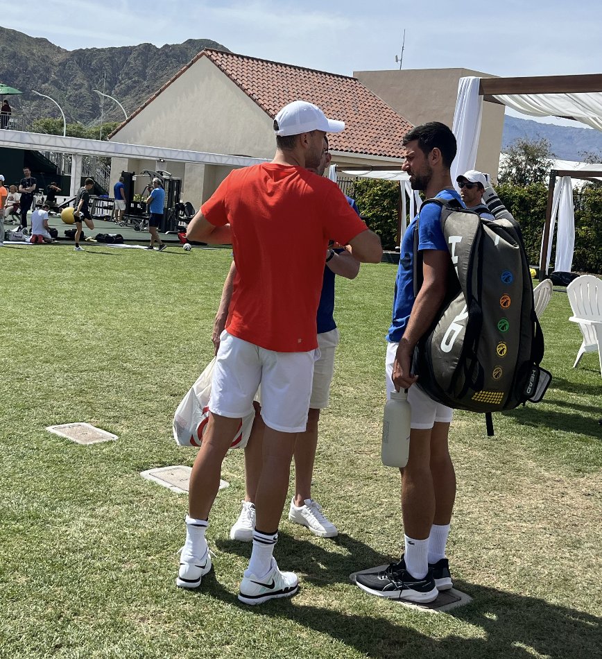 tdnewcomb's tweet photo. Novak Djokovic chatting with Grigor Dimitrov about the benefits of his Asics Court FF 3 Novaks. Joked he's a salesman now. https://t.co/BqNpISwa1O