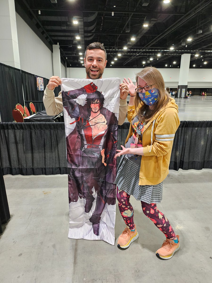sepiamanatee's tweet photo. Went to my first #AMKE in years and found the flame!  @The_Ben_Starr  was an absolute delight to chat with. He signed my body pillow from @deckthisout  and left a sweet little message. I wonder who taught Clive to talk like that... https://t.co/7lWrWMgiez