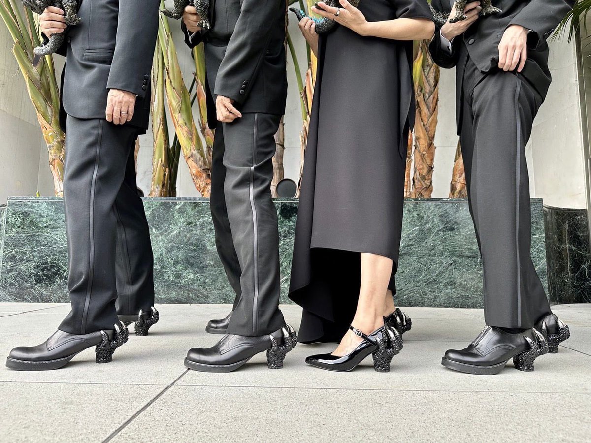 the godzilla team wearing godzilla claws as heels